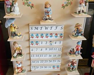 M J Hummel perpetual calendar with month figurines and date tiles made by Hallmark