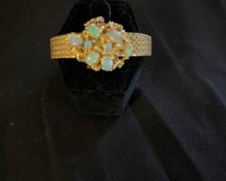 14k Belvile Swiss movement 17 jewel bracelet watch. Approximately 6 carats of Opals.
