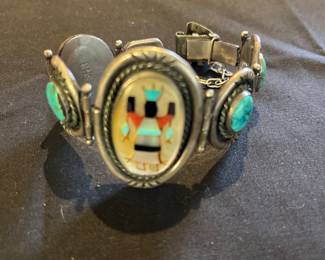 Vintage Apache dancer with cabs of turquoise. Signed RHB for Roland Hogan Begay.