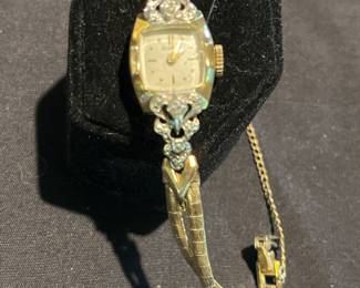 14k case band is gold filled. Diamond accents, Benrus watch