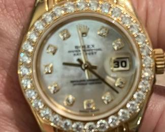 Ladies Rolex. 14k 10 + carats of diamonds