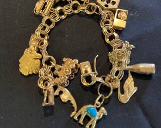 14k bracelet and 14k and 18k charms
48.3 grams