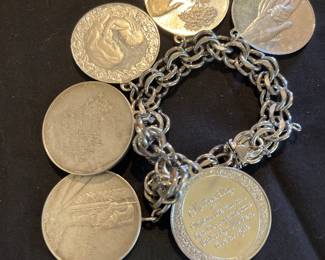 Sterling Mother’s bracelet . Charms have inscriptions by Thomas Carlyle. 107 grams