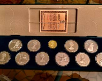 1987/88 Calgary Winter Olympics Coin Set
1- $100 Gold Coin
10 - $20 Silver Coins. Each with a different Event on the back