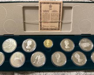 1988 Canadian Winter Olympics $100 GOLD coin and 10 - $20 Silver coins. Each coin has a different Olympic Sport depicted 