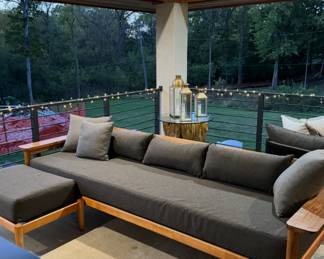 Solid teak, wood outdoor sofa by interior define. This sofa sells for $6000. I am selling it with the ottoman for $1500. It is in fantastic condition.