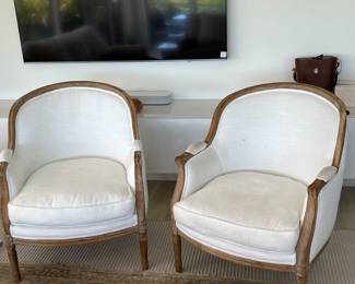 Pair of Restoration Hardware Lyon White upholstered barrel chairs with carved wood