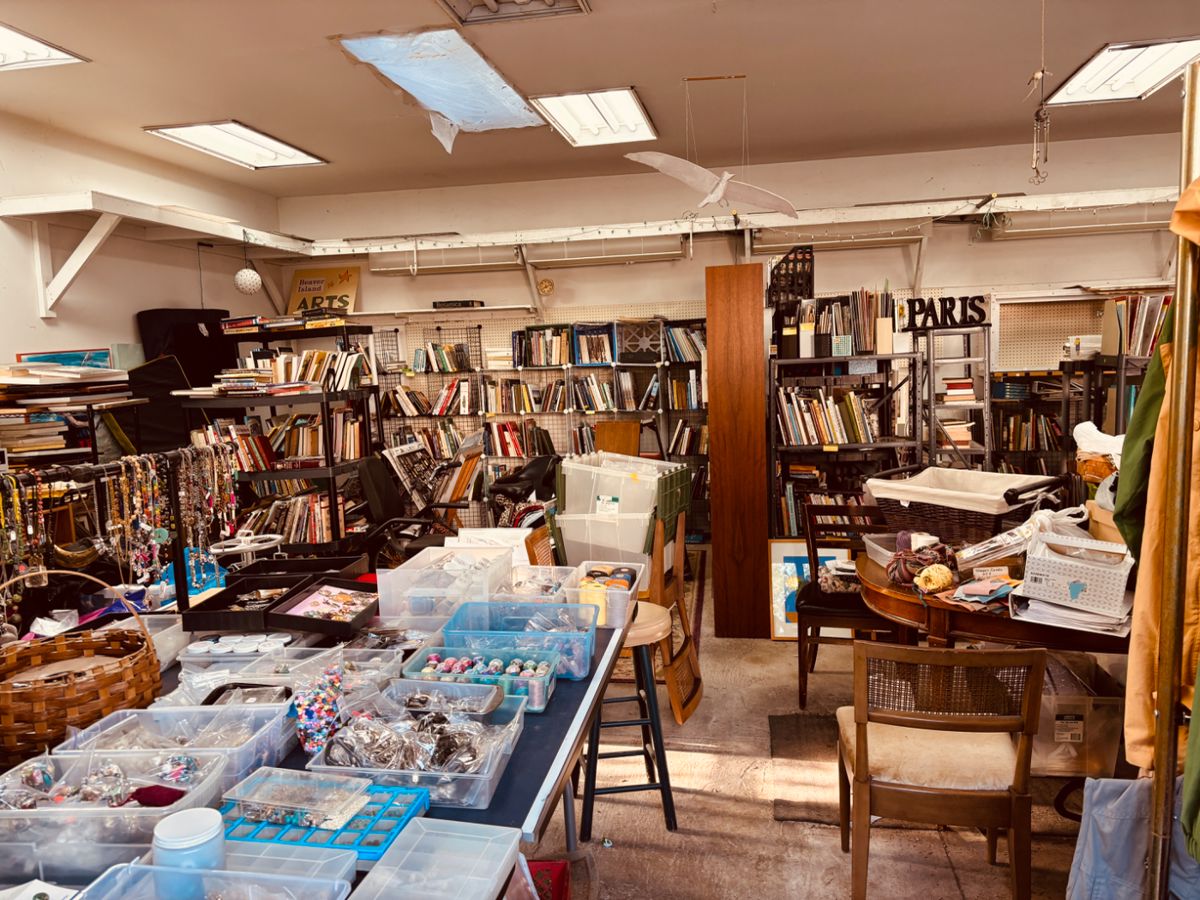The sale is in the large studio/garage behind the house as well as in the yard. Go down the long driveway to the sale.