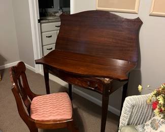 Desk that converts into a card table. Great condition. Was painted when it was purchased but was refinished back original mahogany finish.
