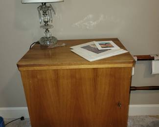 Vintage sewing machine in cabinet