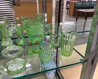 Green Uranium Glass Assorted Items including Pitchers, Salt & Pepper Shakers, Measuring Cup, Glasses, Sherbert Cups, Lids