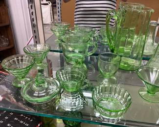 Green Uranium Glass Assorted Items including Pitchers, Salt & Pepper Shakers, Measuring Cup, Glasses, Sherbert Cups, Lids