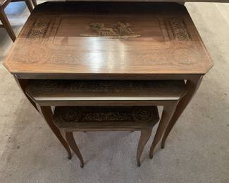 Three really neat nesting tables with glass tops