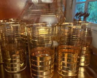 Midcentury gold barware and glasses