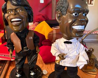 James Brown and Louis Armstrong singing statues