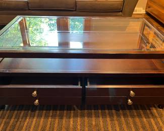 Glass top coffee table with drawers