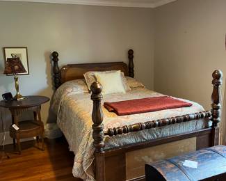 Wood bed. Chest. Bedding.
