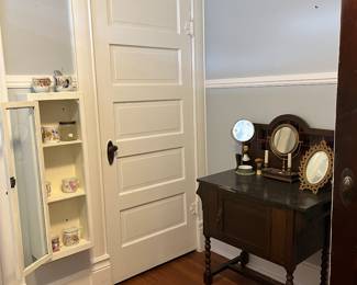 Mugs. Wood vanity. Mirrors.