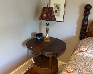 Round end table. Lamp. Wall decor.