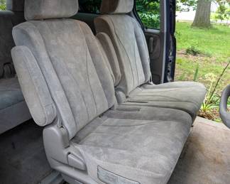 Middle row, passenger side 
