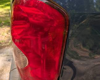 Close up of dents and brake light cover (passenger side)