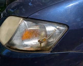 Crack in plastic headlight cover (driver's side)