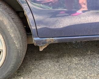 Close up of rust (passenger side)