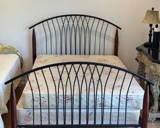 Full sized black bed frame. Comes with mattress & box spring