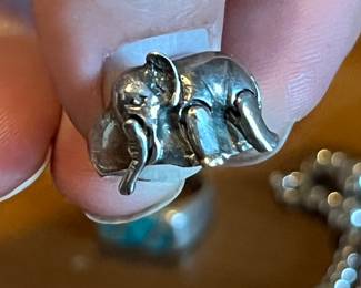 Trunk & both legs move on this articulated happy elephant ring cast in sterling silver.