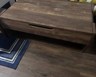 Coffee table with riser and storage 