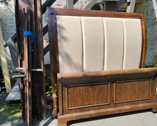 Queen size bed. Solid wood, heavy. Requires box spring. Asking $100