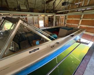 1970s 22 foot North American  fiberglass boat with a 160 hp MerCruiser engine. Engine needs work.