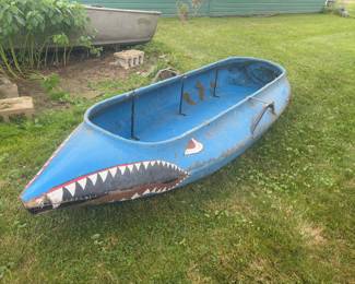 Vintage fiberglass 10 foot canoe.