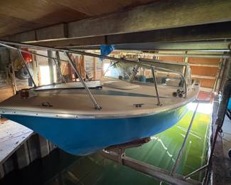 1970s 22 foot North American  fiberglass boat with a 160 hp MerCruiser engine. Engine needs work.
