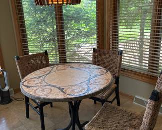 Mosaic tile top bistro table and rush chairs
