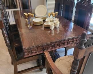 Ornate Mexican table with 8 chairs, glass top