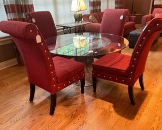 PLATNER DINING TABLE BY KNOLL shown with four red upholstered chairs