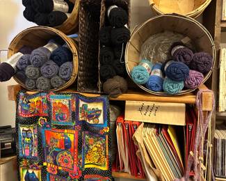 Yarn Skeins, Wicker Buckets, and Hand Knit Items