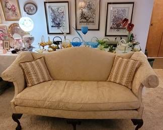 Vintage upholstered, down-filled Camelback sofa with solid wood fame. Assorted collectable vintage glass (Fenton, Westmoreland, Indiana Glass Company, Duncan & Miller, etc). Assorted framed prints and paintings. Antique Lamps.
