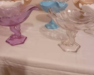 Large and medium Westmoreland Dolphin/Koi Shell Pedestal Compotes. Bakewell, Pears & Co Dolphin/Koi Pedestal Compote. Walther-Glas Saturn Clear Footed Dish.