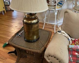 Wicker side table with large brass lamp