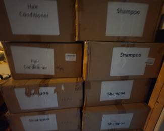 Boxes and Boxes of ReviveMe Caffeine Shampoo and Conditioner