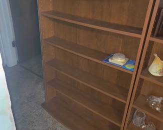 There are three narrow shelf units, approx. 10" deep