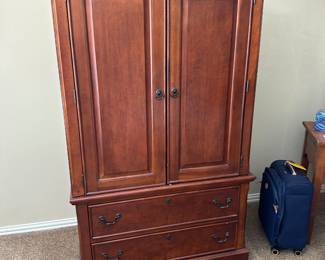 Dark wood entertainment armoire