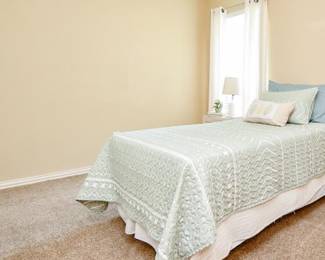 Twin bed (on risers; risers and frame included)