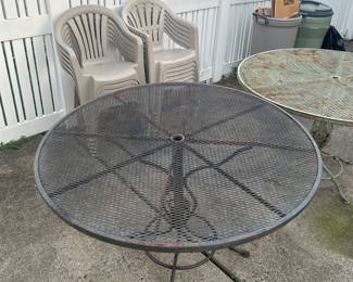 Two metal patio tables