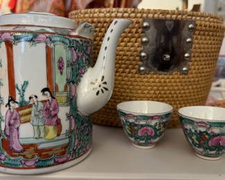 Vintage Chinese Wicker Tea Basket With Tea Pot & Tea Cups- 4 Pieces

Details Close
Description
A vintage Chinese teapot and two cups are tucked into a colorful lined tea cozy basket.

The finely woven basket is lined with a vivid, bright floral fabric.

The latch keeps the lid tight while the basket is carried.

The teapot and teacups are vintage Jingdezhen red and white enamel.

This intricately patterned tea set hails from Jingdezhen, China’s legendary porcelain capital. Marked in both Chinese and English with a factory number.