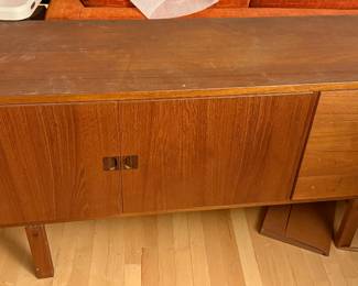 The "Corona" sideboard in teak with rosewood handles