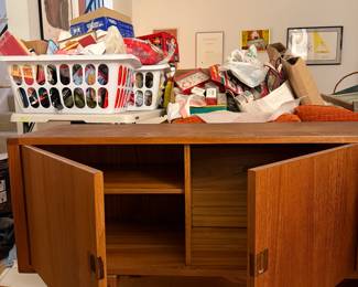 The "Corona" sideboard in teak with rosewood handles