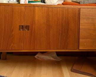  a "Corona" sideboard in teak with rosewood handles, designed by Lennart Bender for Ulferts of Sweden in the 1960s. Sdeboard by Lennart Bender with sophisticated details. Made from solid teak. The gap between the legs and body creates a floating effect. Beautifully hollowed out handles, rosewood around the drawer handles. Felt dressed inside of the top drawer with two levels intended for cutlery.
Designer: Lennart Bender
Maker: Ulferts
Year: 1960s
Country: Sweden
Condition: Very good vintage condition consistent with age and use
Size: Height 27.5 in, Width 63.7 in, Depth 17.7 in